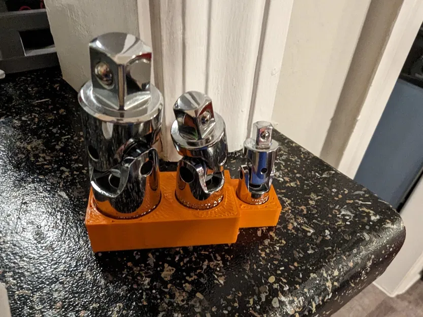 Người giữ bộ bộ điều hợp ổ cắm chung - Image 2