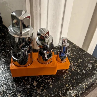 Người giữ bộ bộ điều hợp ổ cắm chung