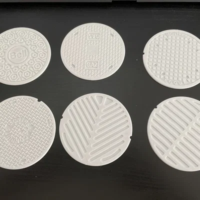 Đế lót ly hình nắp cống đặc trưng của Montreal