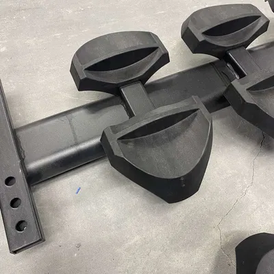 Giá đỡ gậy tạ trên máy tập thể hình