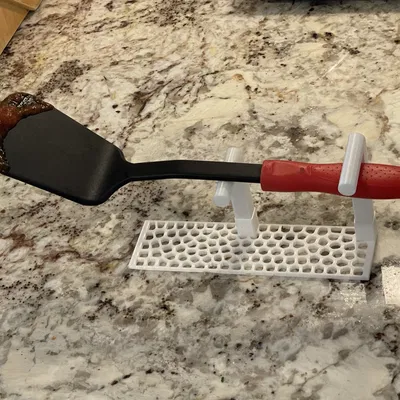 Giá đỡ thìa và spatula giúp giữ sạch bề mặt làm việc