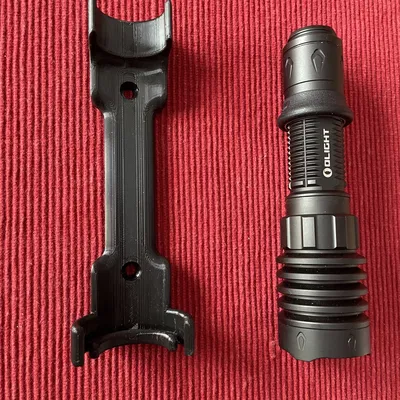 Giá đỡ đèn pin Olight Warrior 4X gắn tường hoặc tủ