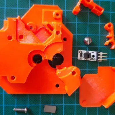 Bộ phận extruder phía sau Prusa Mini với cảm biến filament