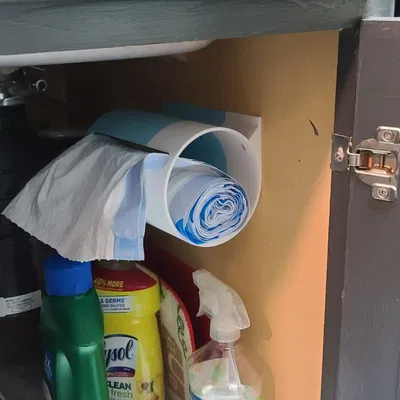 Máy phân phối túi rác gắn bên hông tủ đựng đồ