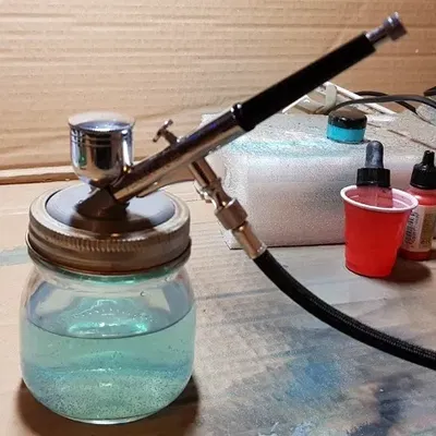 Giá đỡ và nắp vệ sinh cho súng phun sơn