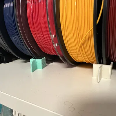Giá đỡ cuộn filament ngăn chặn cuộn lăn