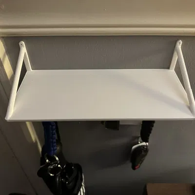 Nắp công tắc đèn có móc treo và kệ để đồ