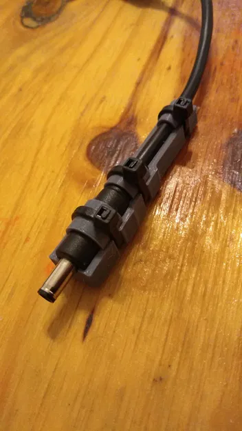 Giá đỡ cáp nguồn Dell chống gãy cho laptop - Image 1