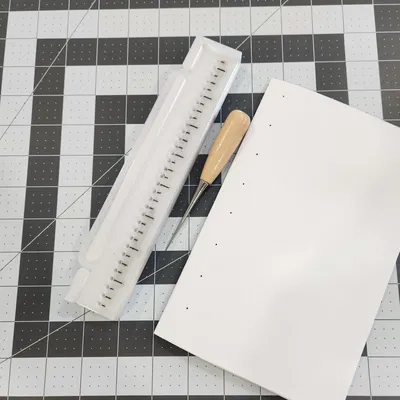 Hướng dẫn công cụ đục lỗ cho sách Coptic