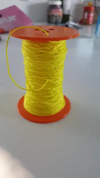 Cuộn chỉ cho dây mảnh dễ dàng quấn bằng trục khoan - Image 1