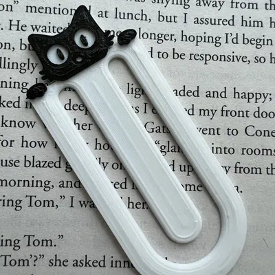 Dấu sách mèo đang peek qua trang sách