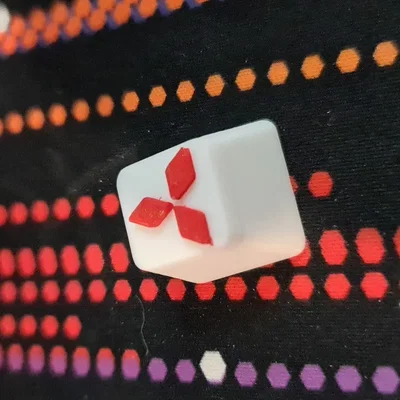 Núm phím Mitsubishi in màu trắng và đỏ