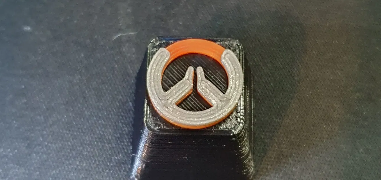 Mô hình keycap Overwatch in màu đen - cam - bạc - Image 1