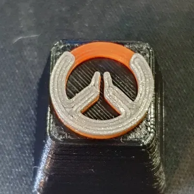 Mô hình keycap Overwatch in màu đen - cam - bạc