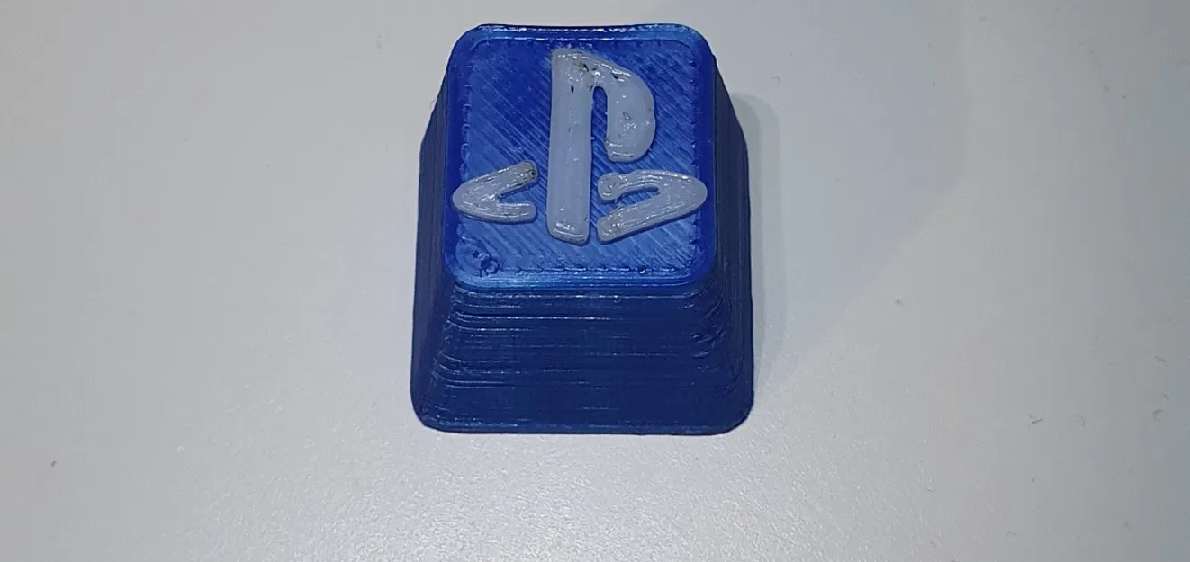 Nút bấm Playstation in màu xanh và trắng - Image 1