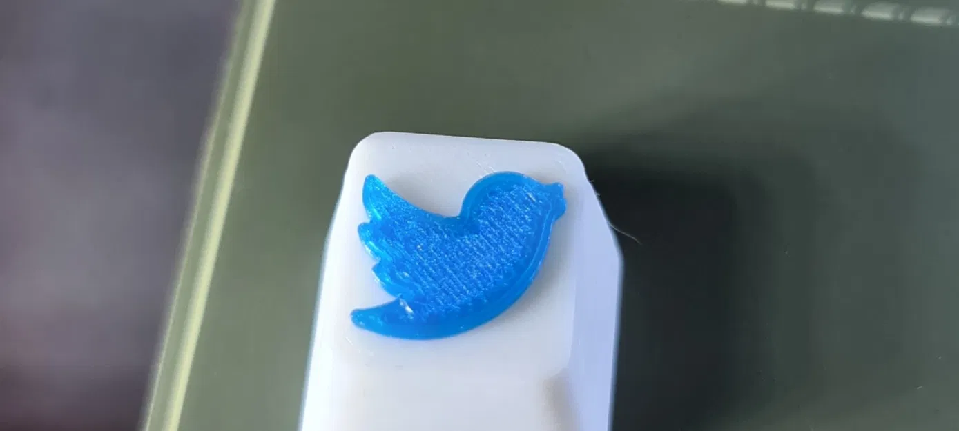 Núm điều khiển Twitter in màu trắng và xanh dương - Image 1