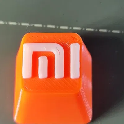 Núm phím Xiaomi in màu cam và trắng