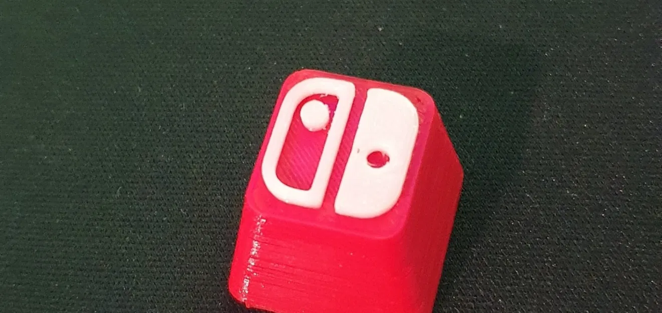 Nút bấm Nintendo Switch in màu đỏ và trắng - Image 1