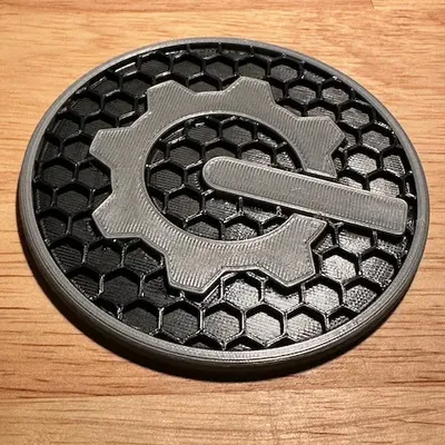 Đế lót ly với biểu tượng bánh răng