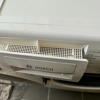 Nắp che cho ngăn chứa bột giặt máy giặt