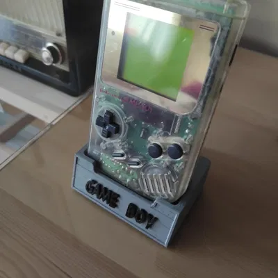 Giá đỡ cho máy chơi game cầm tay Game Boy