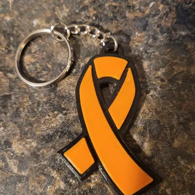 Móc khóa hình ruy băng chống ung thư thiết kế cho từ thiện