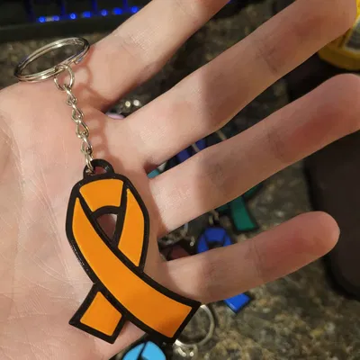 Móc khóa hình ruy băng chống ung thư thiết kế cho từ thiện