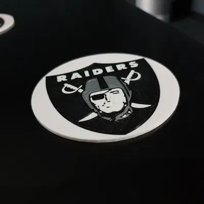 Đế lót ly đa vật liệu với biểu tượng Raiders