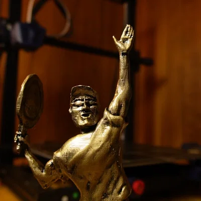 Cúp tennis in hình cha tôi yêu thích môn thể thao này