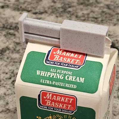 Kẹp giữ nắp hộp sữa an toàn và chắc chắn