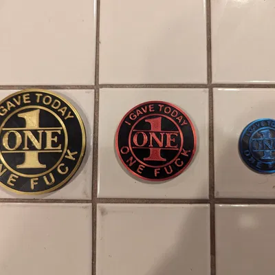 Đồng xu F**K to Give với chi tiết lớp trên/dưới