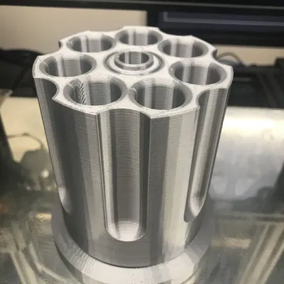 Giá đỡ bút hình súng lục xoay