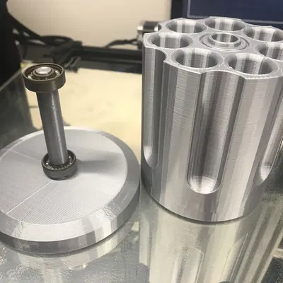 Giá đỡ bút hình súng lục xoay