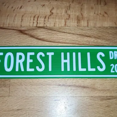 Biển báo đường "2014 Forest Hills Drive" của J. Cole