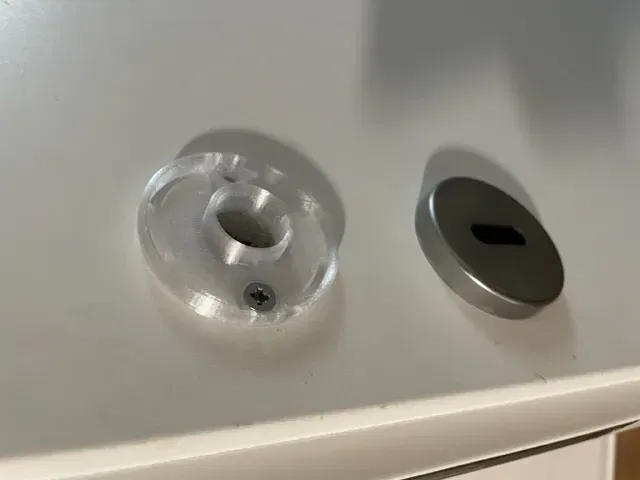 Phụ kiện nhựa dưới rosette cửa bị hỏng cần thay thế - Image 2