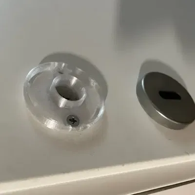 Phụ kiện nhựa dưới rosette cửa bị hỏng cần thay thế