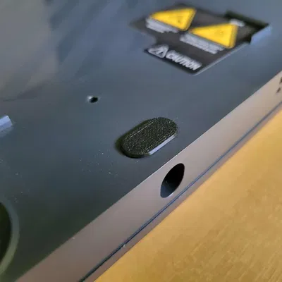 Nắp che lỗ dưới đế máy in P1P