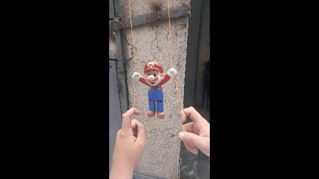 Nhân vật Mario leo dây trong trò chơi Mario Bros - Image 1