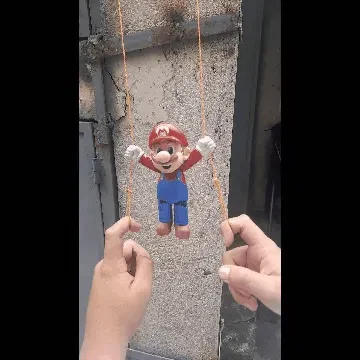 Nhân vật Mario leo dây trong trò chơi Mario Bros