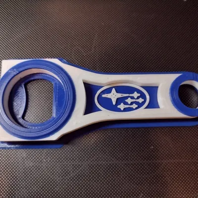 Mở nắp chai bằng tay nối với logo Subaru