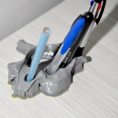 Giá đỡ bút hình đốt sống cổ