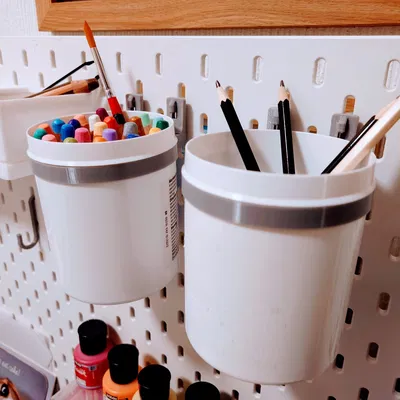 Giá đỡ bình chứa kem Aqueous trên bảng ghim Ikea Skadis