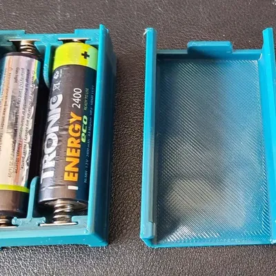 Bộ pin AA hai viên với nắp trượt một chiều