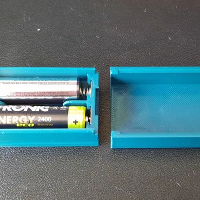 Bộ pin AA hai viên với nắp trượt một chiều