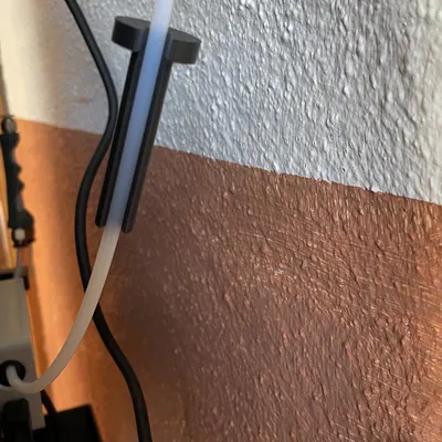 Trợ thủ nhỏ để tháo ống PTFE từ bộ đệm filament AMS