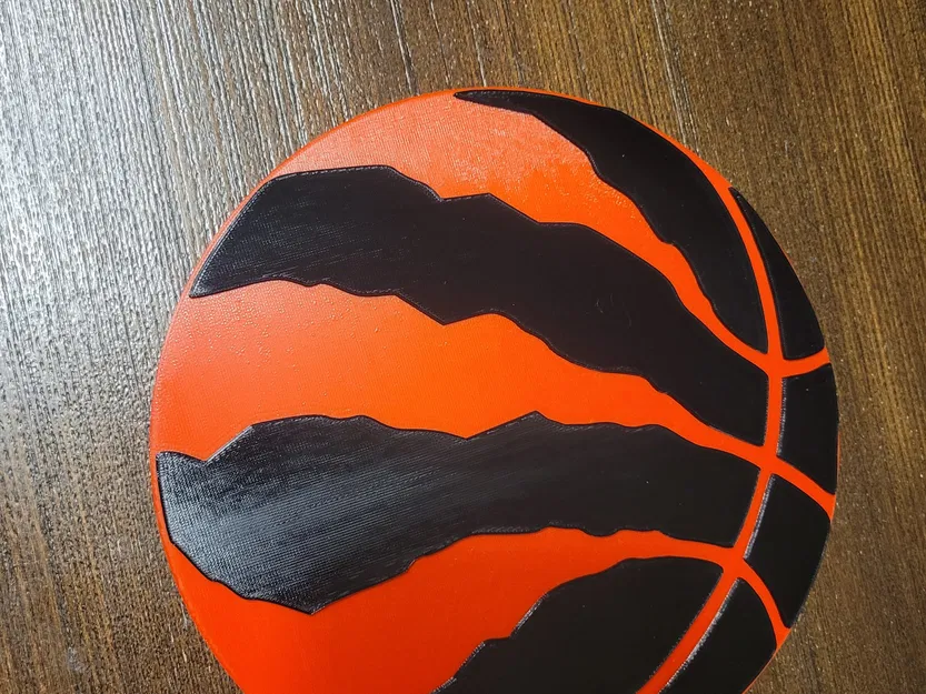 Biểu tượng Raptors với các cạnh tròn và chi tiết bóng nổi bật - Image 1