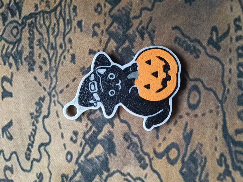 Móc khóa mèo Halloween ngồi trên bí ngô - Image 1