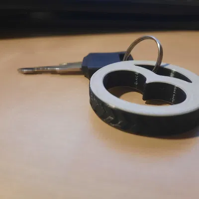 **Móc khóa logo Babetta hình dạng lốp xe**