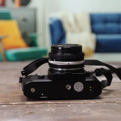 Thay thế nắp ren pin cho máy ảnh Nikon EM