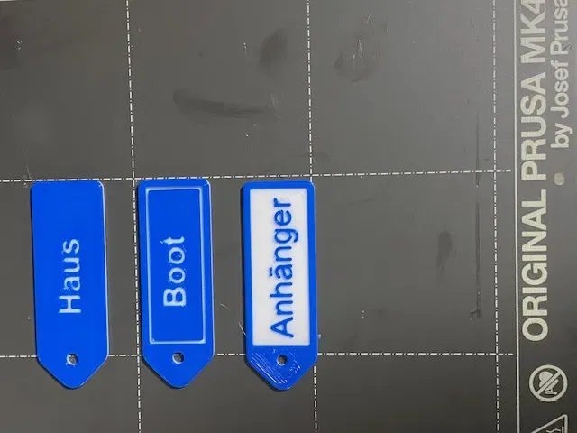 Móc khóa tùy chỉnh hai màu với thiết kế đa dạng - Image 3